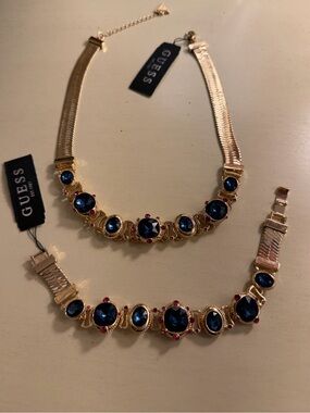 NWT Guess statement necklace & bracelet w/blue “jewels”. Both adjustable.
